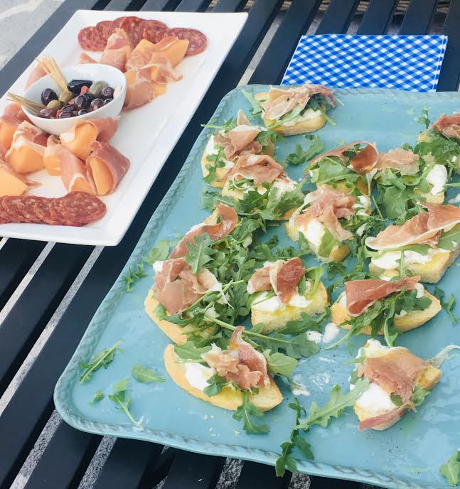 Bruschetta with Buratta and Prosciutto on blue platter