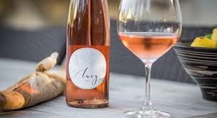 Lucy Rose Wine in a glass and bottle