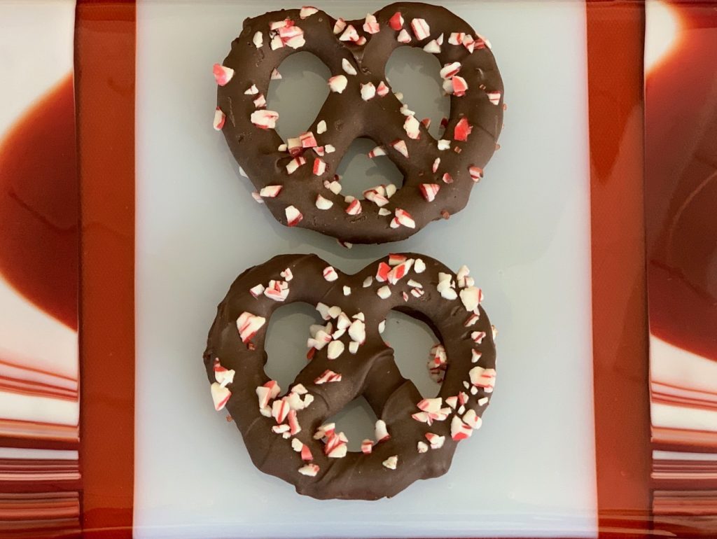 Chocolate dipped pretzels with candy cane sprinkles