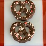 Chocolate dipped pretzels with candy cane sprinkles