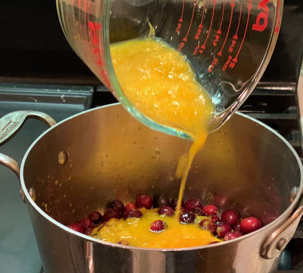 Add orange juice & zest to cranberries