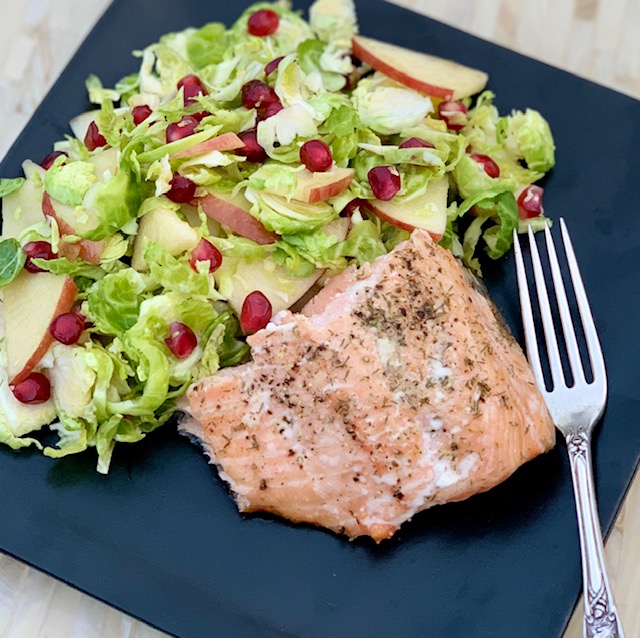 Brussel sprout, pomegranate, apple salad with salmon