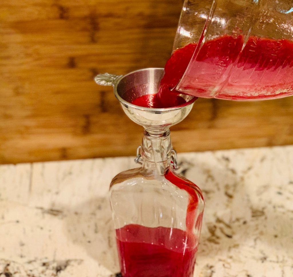 Decanting cranberry liqueur