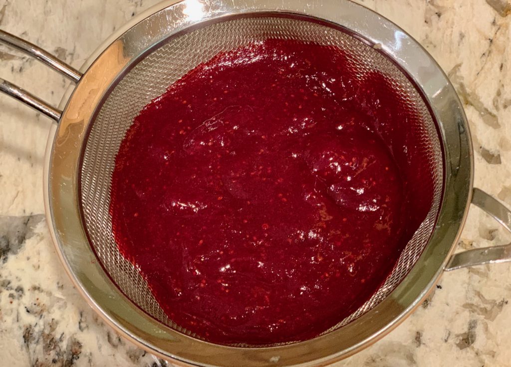 Straining cranberries