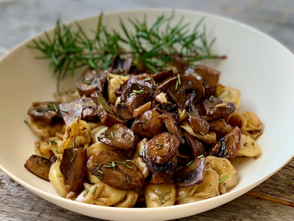 Garlic Herb Mushrooms in a bowl with pasta