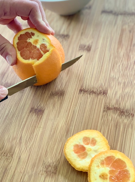 Cutting the peel for orange supreme