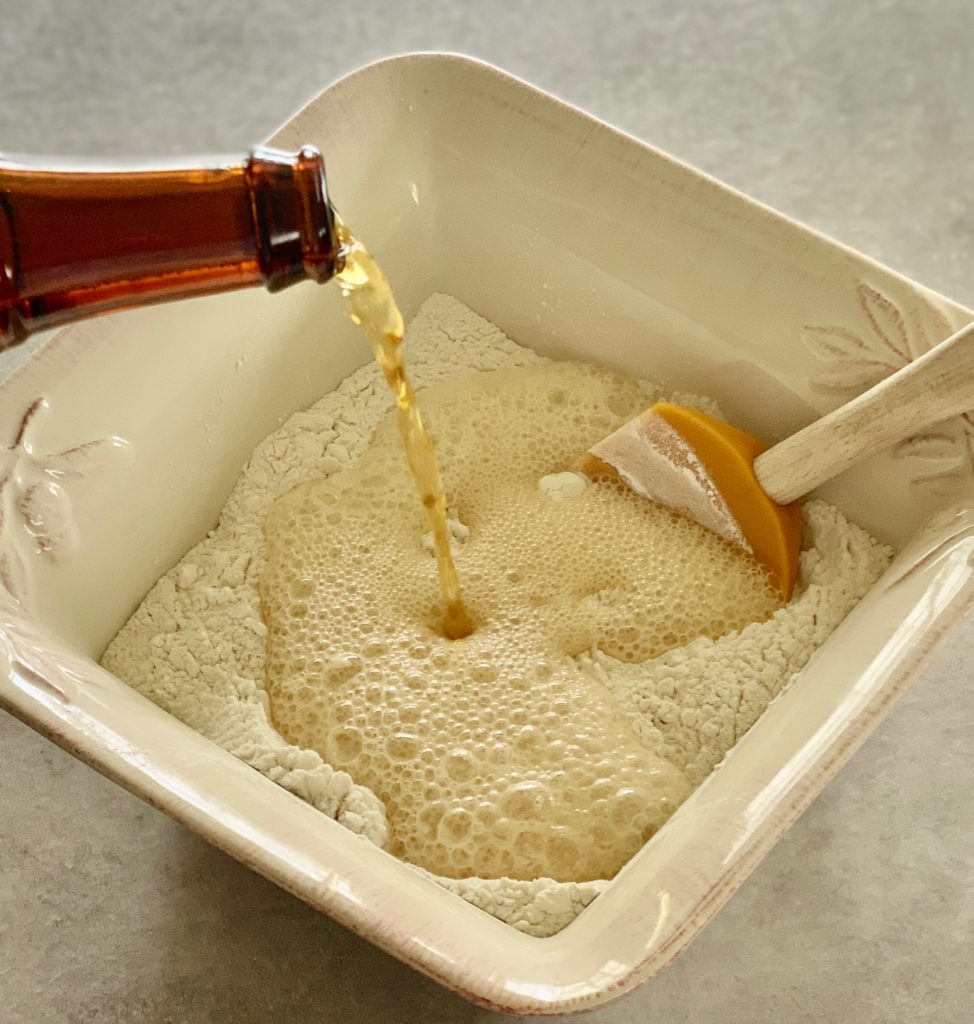 Pouring beer into flour and sugar