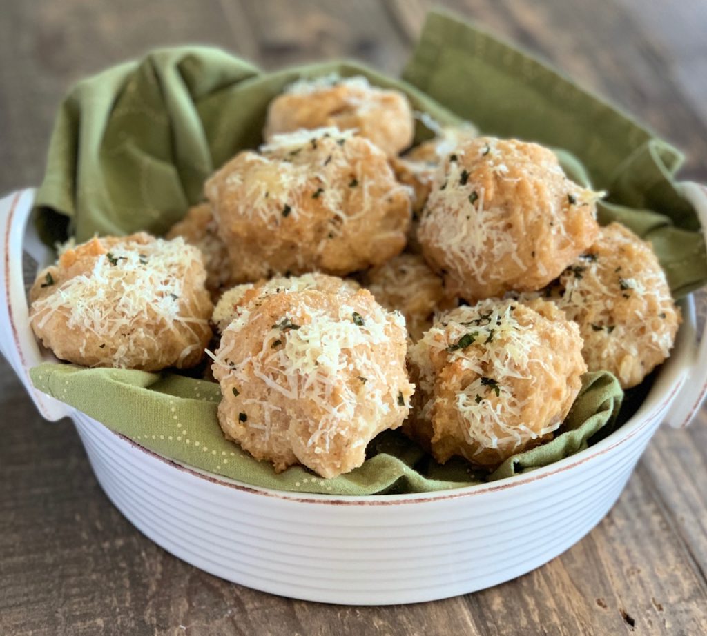 Parmesan Parsley Beer Bread Rolls in a white basket