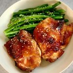 baked asian chicken with green beans in a bowl