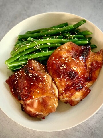 baked asian chicken with green beans in a bowl
