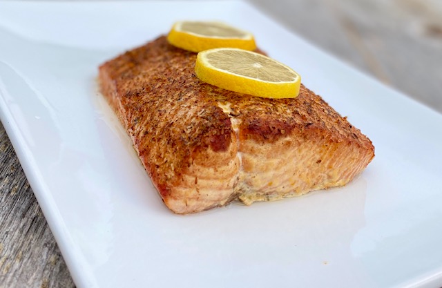 Cedar Plank Salmon with Potlatch Seasoning and lemons