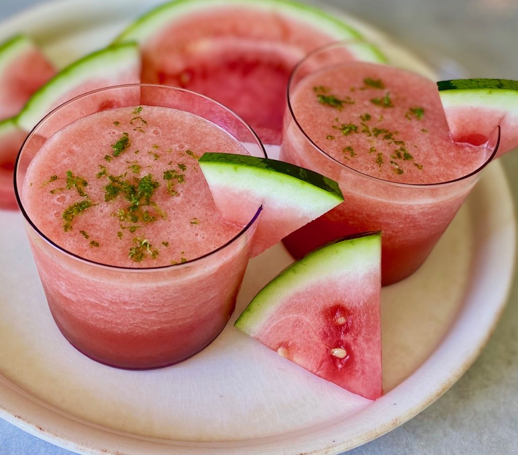 Watermelon Vodka Cocktail with lime on a white tray