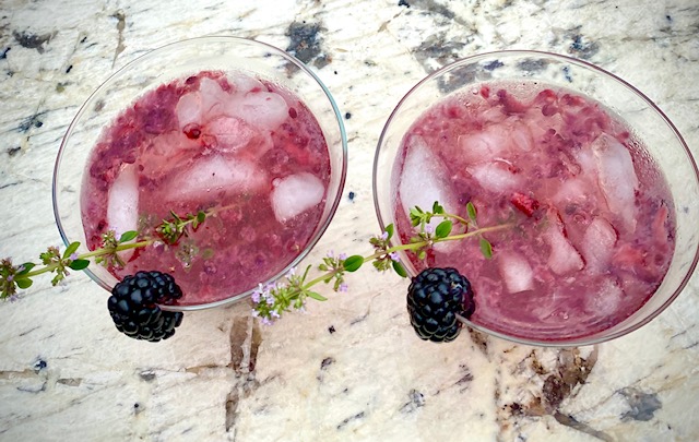 Blackberry champagne cocktails with garnish