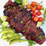 Carne Asada on a platter with vegetables