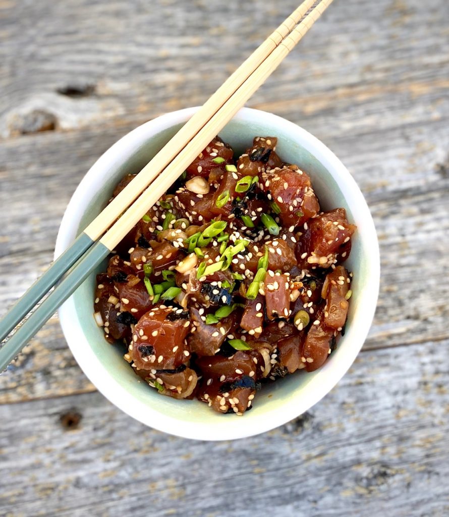 Ahi Poke in a bowl with chopsticks