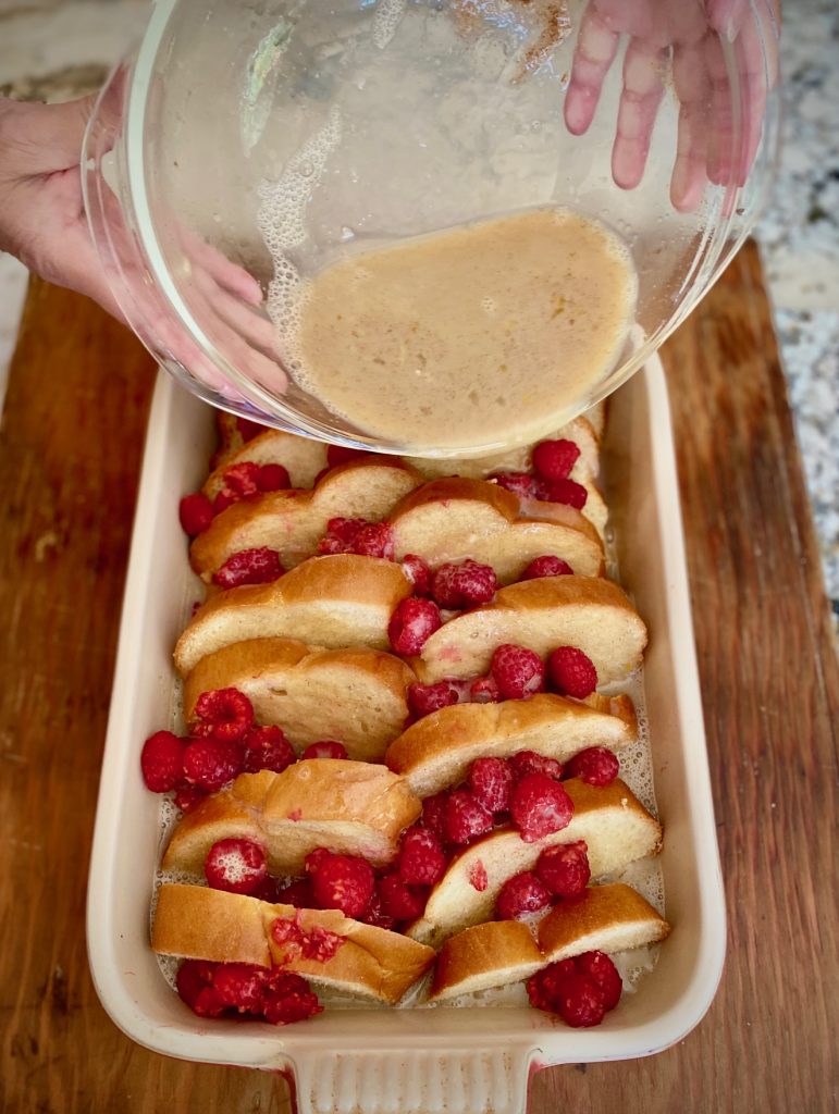 Pouring liquid evenly over French bread