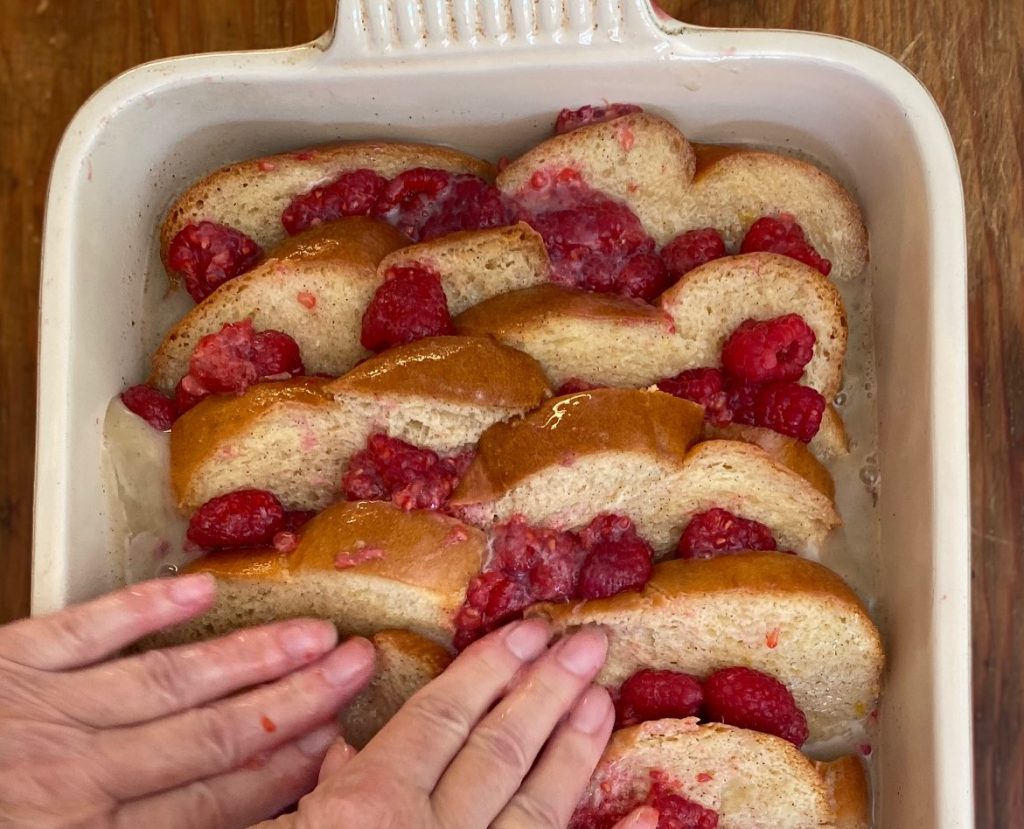 Press French Toast Casserole to submerge