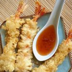 tempura shrimp with sweet chili sauce on a spoon