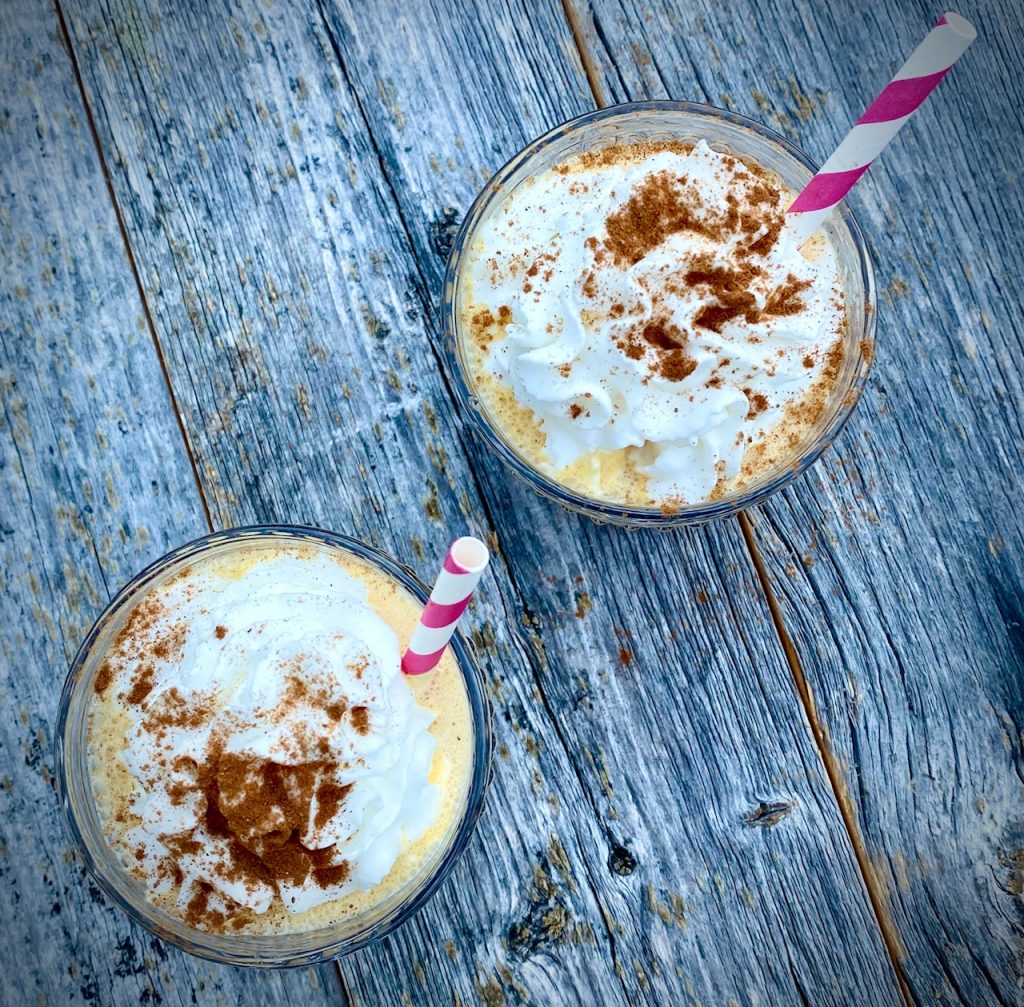 Overhead view of 2 pumpkin shakes