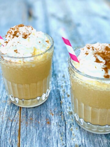 2 Pumpkin Pie Shakes with whipped cream and pink straws