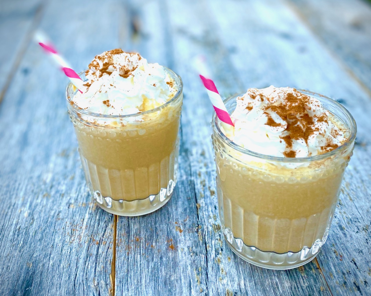 2 Pumpkin Pie Shakes with whipped cream and pink straws