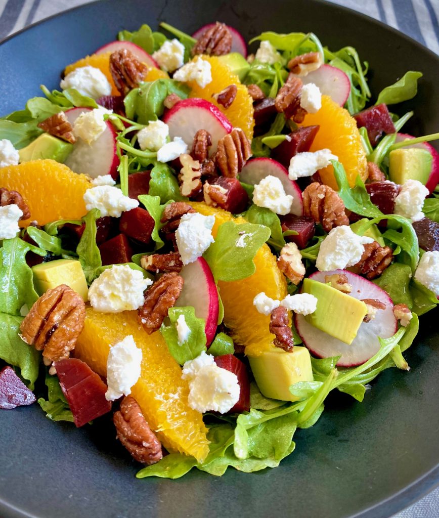 Arugula Beet Salad with goat cheese, oranges, avocado and radishes