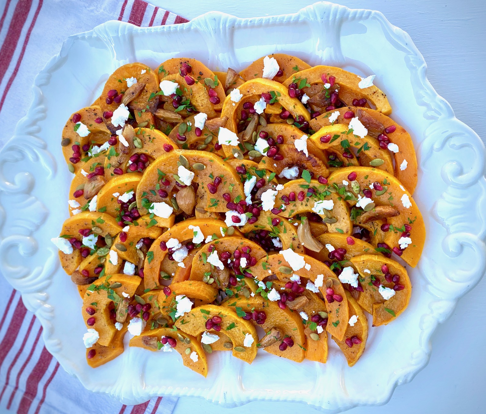 Platter of Roasted Butternut Squash with Pomegranate, Goat Cheese and Parsley