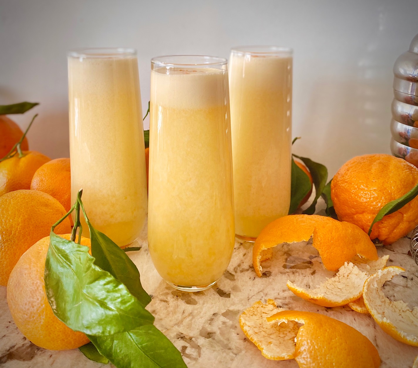 3 Orange Creamsicle Martinis with oranges