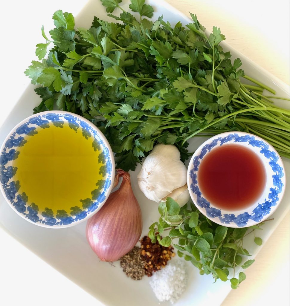 chimichurri ingredients on a white plate