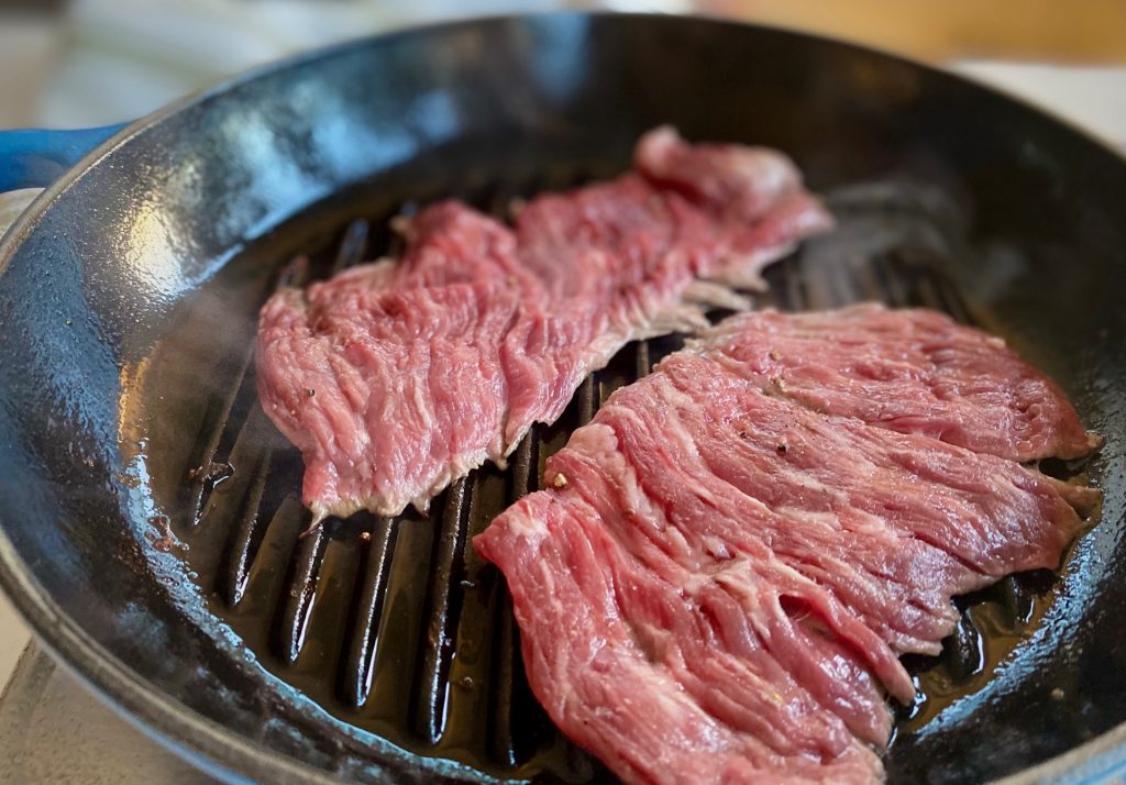 grilling skirt steak in a grill pan