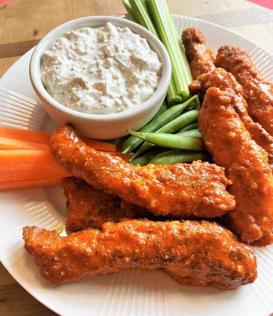 Buffalo Chicken tenders with dip, celery and carrot sticks