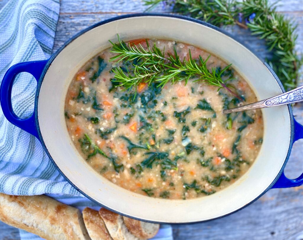 One pan of kale white bean soup with rosemary