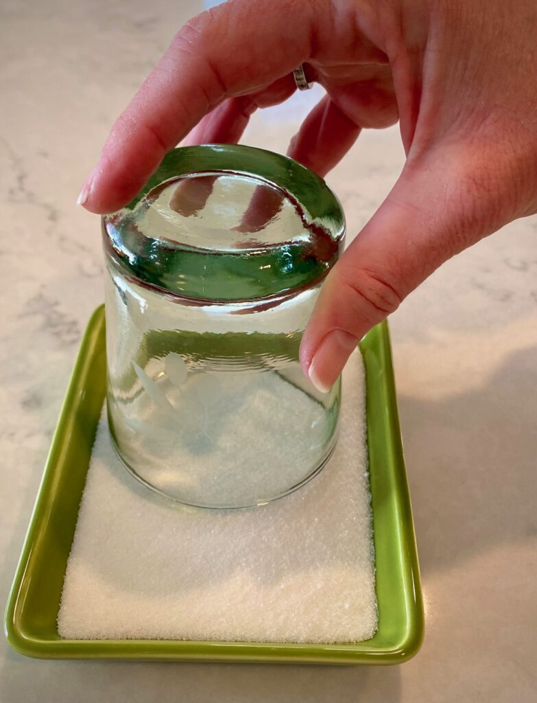 dipping a glass in sugar