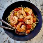 Black bowl with Shrimp and Tomatoes