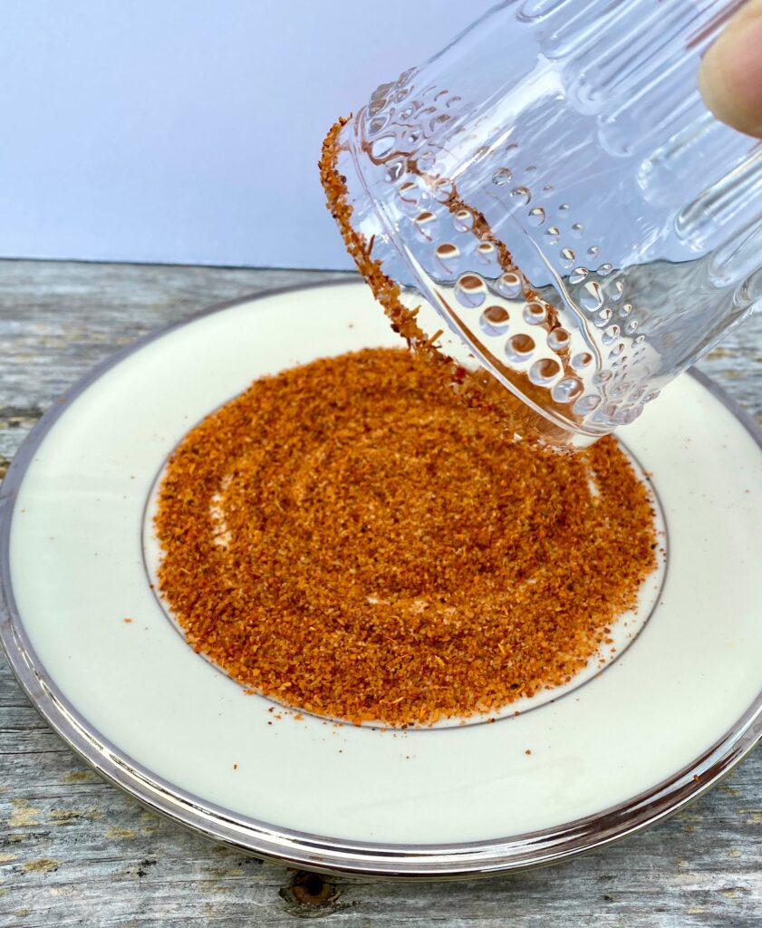 Coating a glass in Tajin seasoning