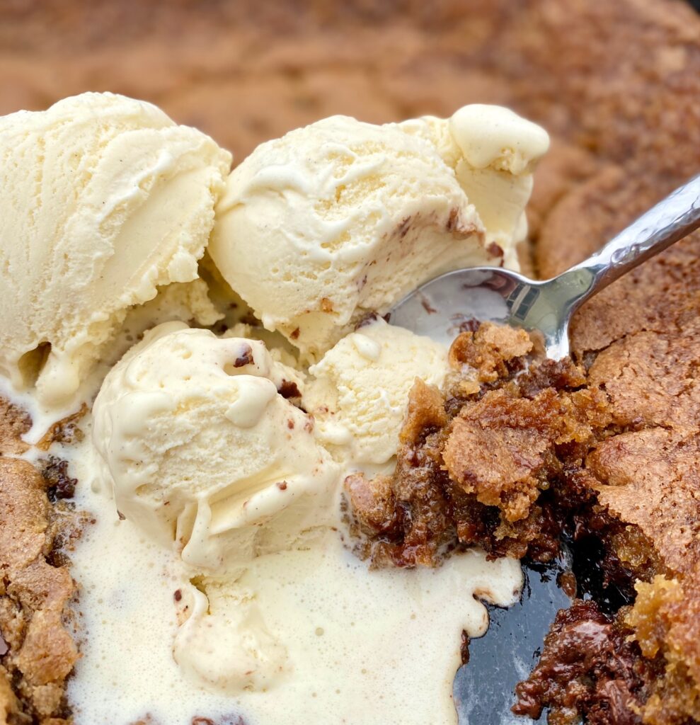 Skillet Chocolate Chip Cookie with ice cream melting