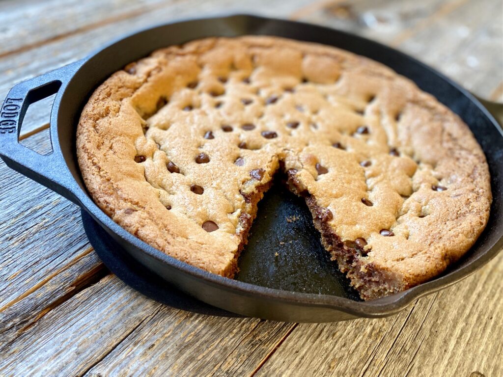 choc chip skillet cookie with slice cut