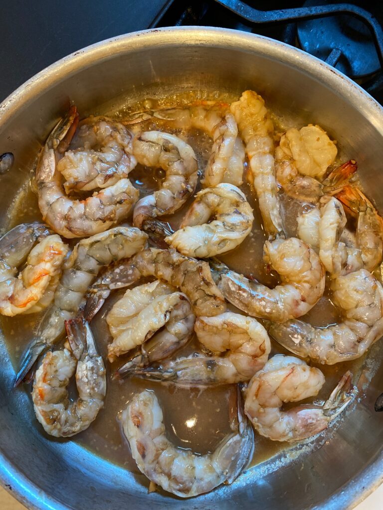 shrimp cooking in a saute pan