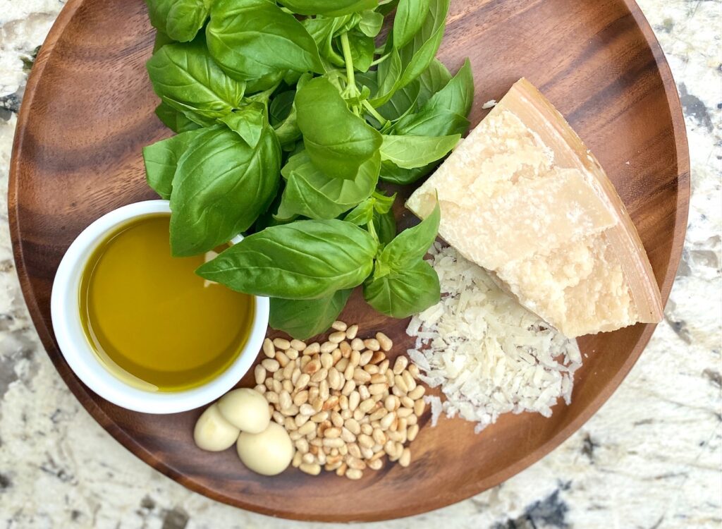 brown plate with pesto sauce ingredients