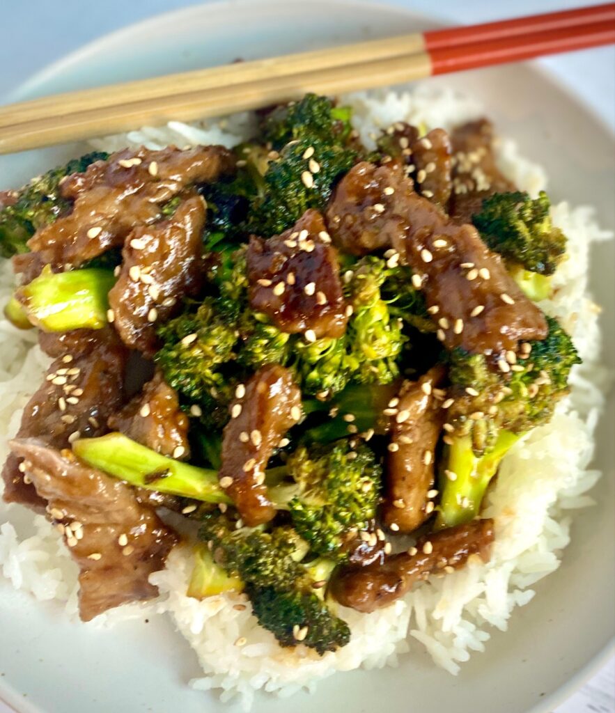 Stir fry broccoli beef in a bowl with rice