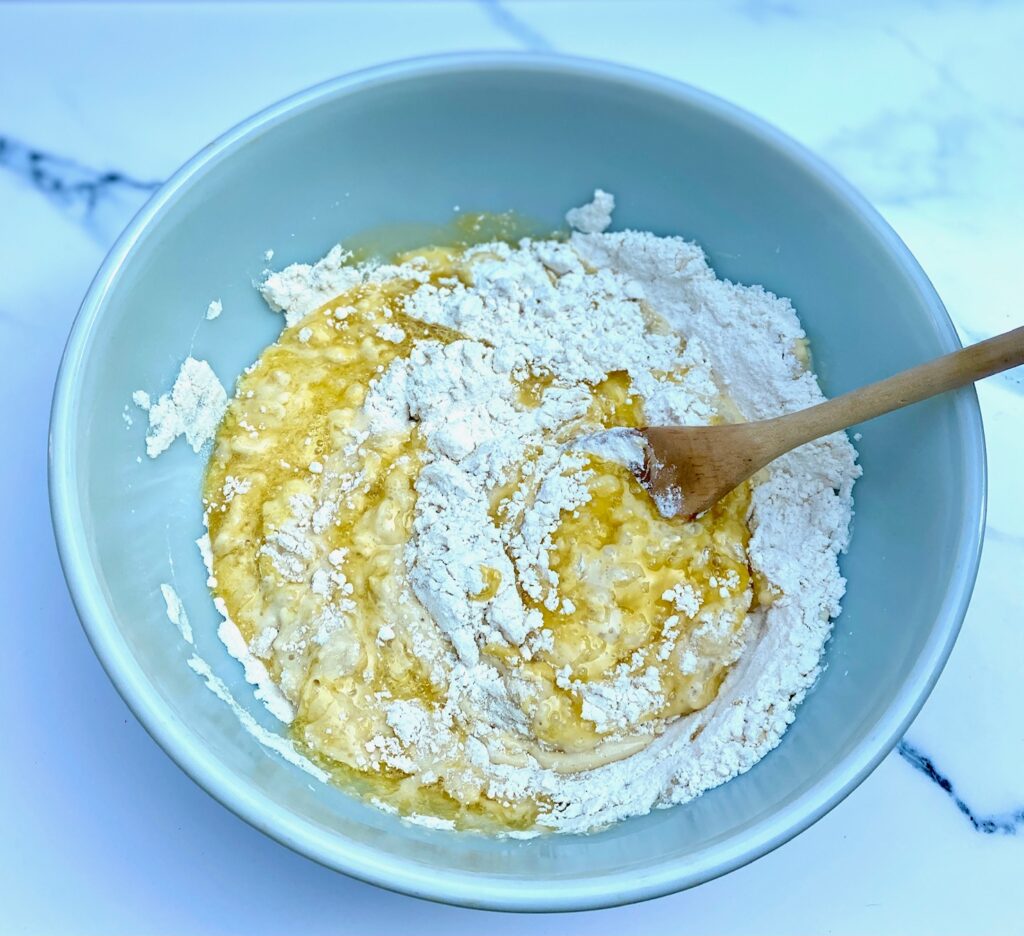 Waffle mix being mixed in blue bowl