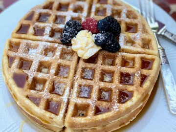 waffle on plate on red table