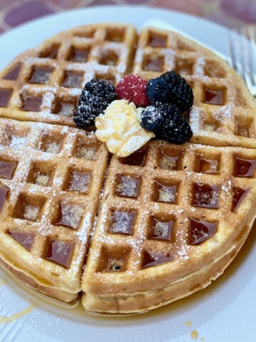 waffle on plate on red table