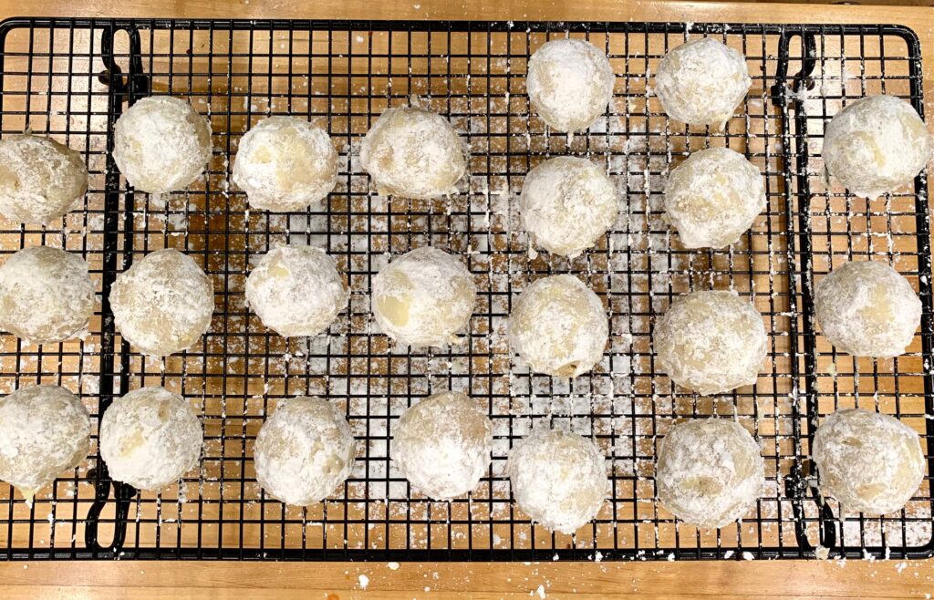cooling rack of Mexican wedding cookies
