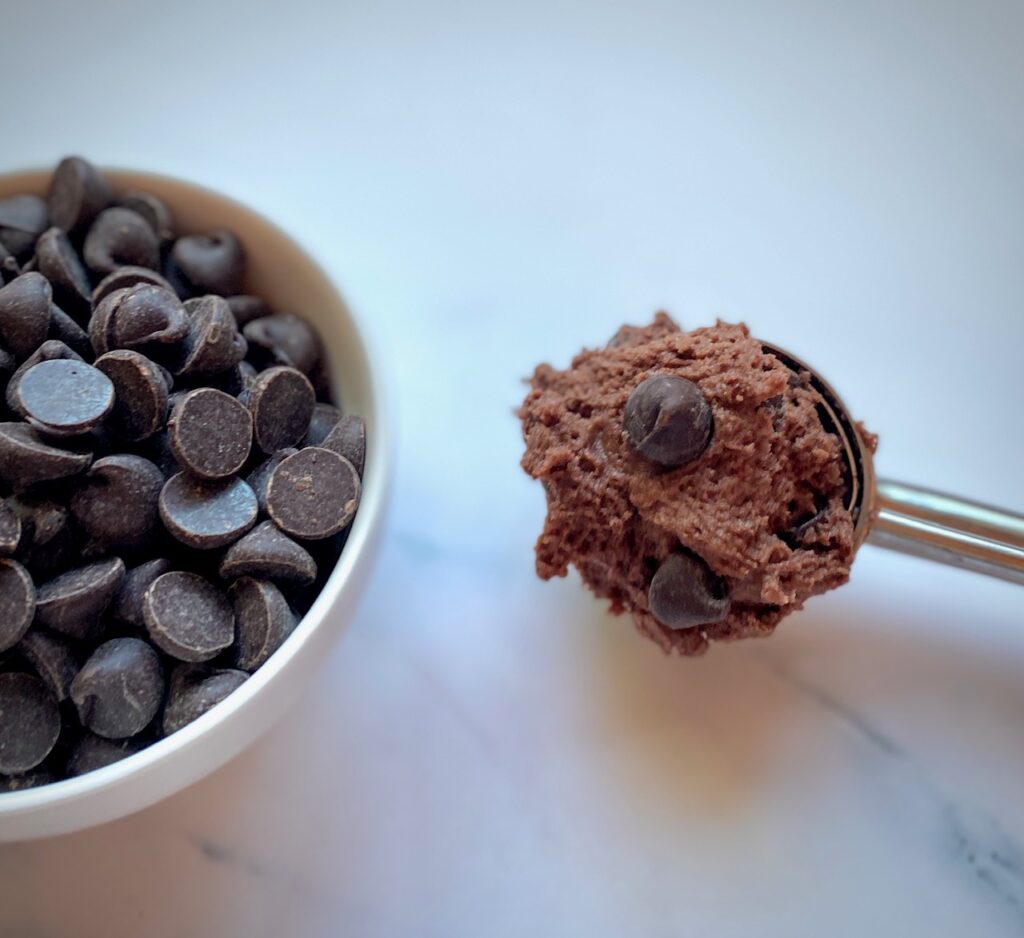 Cookie scooper and bowl of chocolate chips