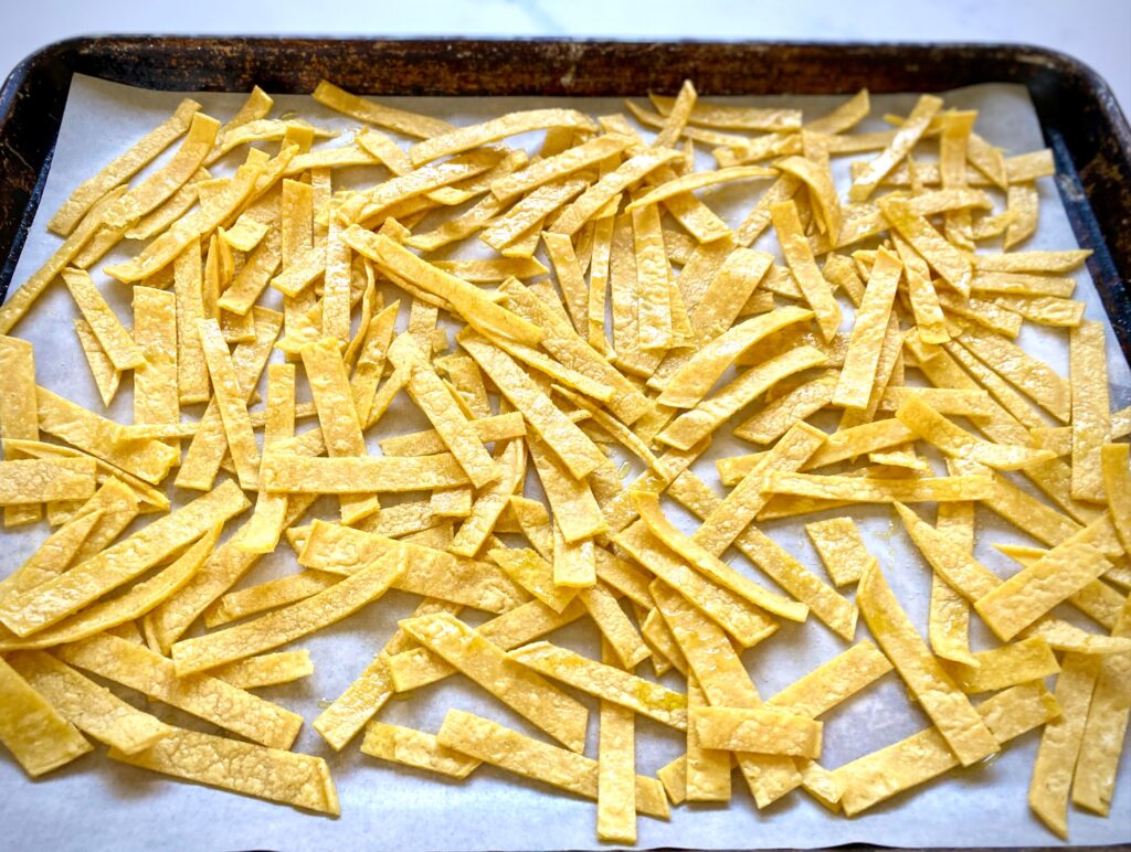 tortilla strips on a sheet pan