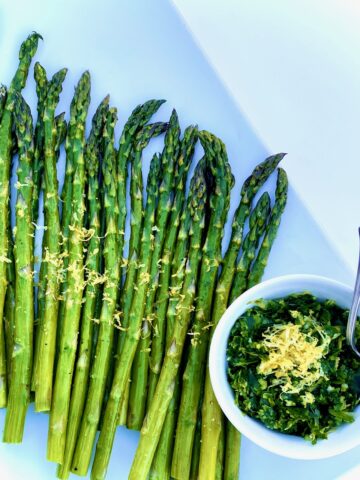 asparagus with Gremolata on a white plate