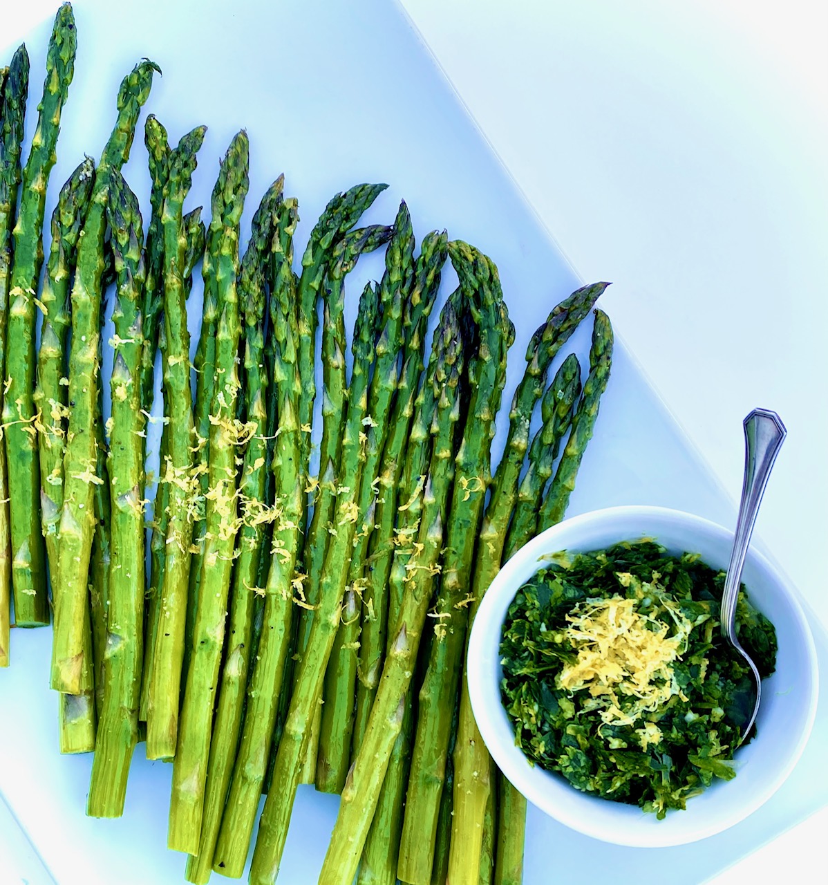 asparagus with Gremolata on a white plate