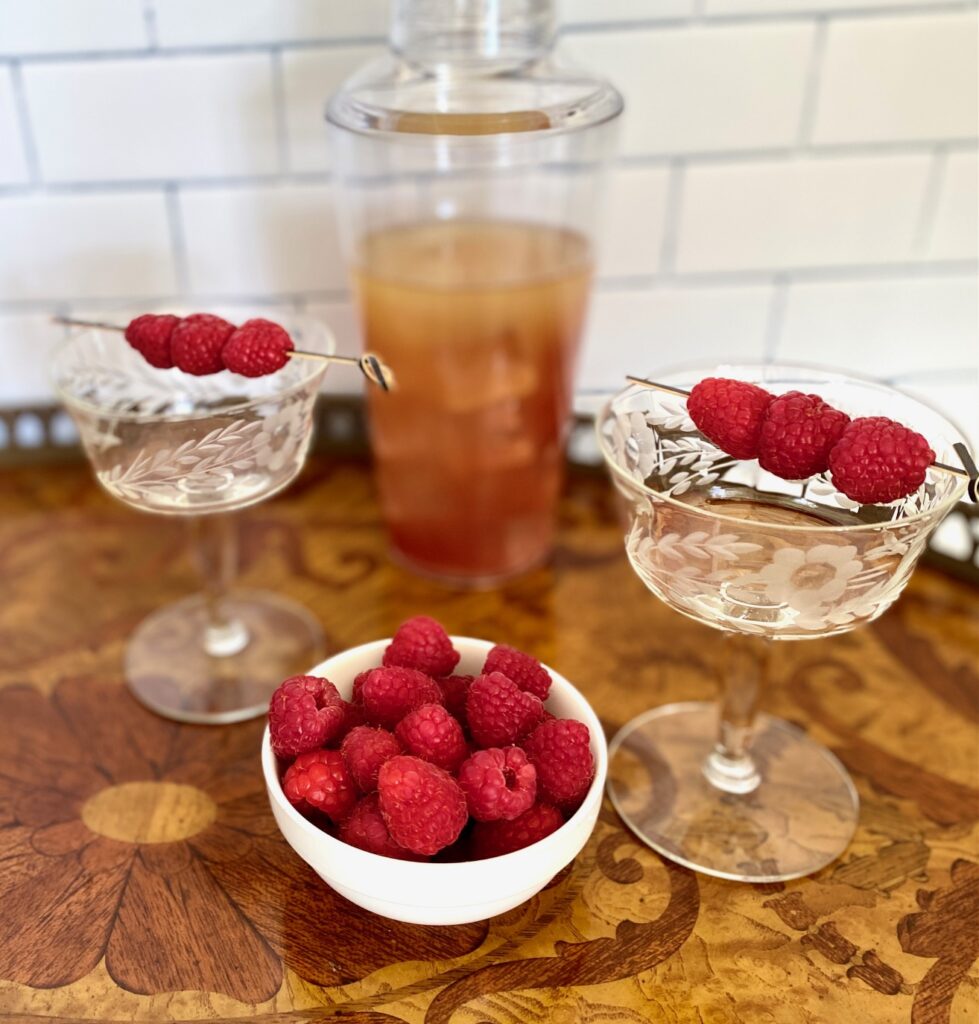 Shaker, glasses, raspberries for French Martinis