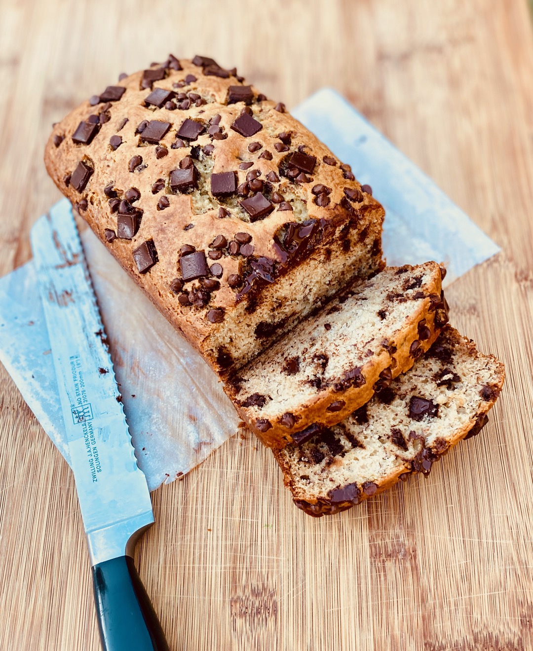 full loaf banana bread with knife